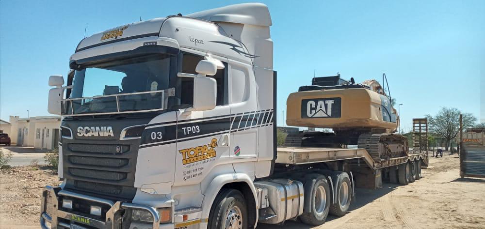 Topaz Transport Scania lowbed hauling a CAT excavator in Namibia