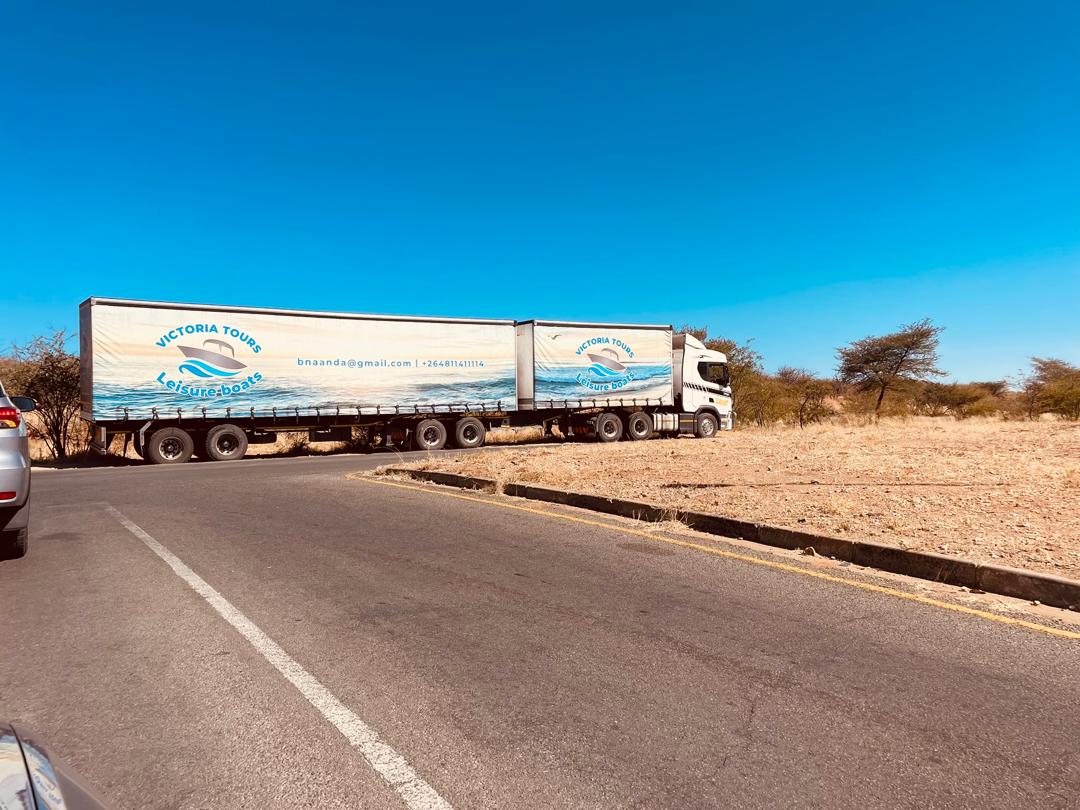 Topaz Atlantic Logistics truck and interlink trailers on the road